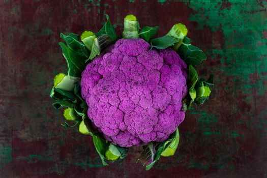 cauliflowers seen from above on old dark board