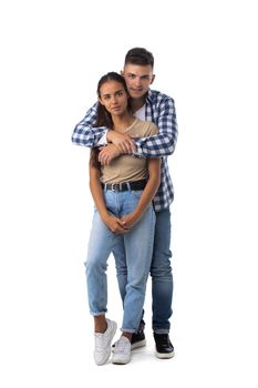 Full body portrait of young happy hugging couple, looking at camera with smile. Caucasian models in love, relationship, dating, flirting, lovers, concept, isolated on white background.