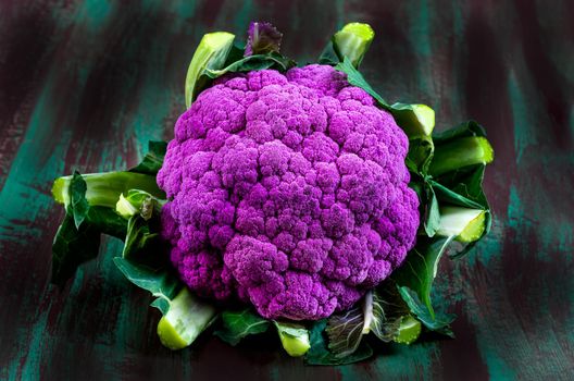 cauliflowers seen from above on old dark board