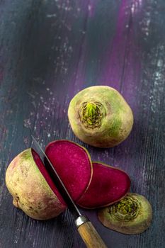 Slices of pink watermelon radish and purple Blue Meat radish