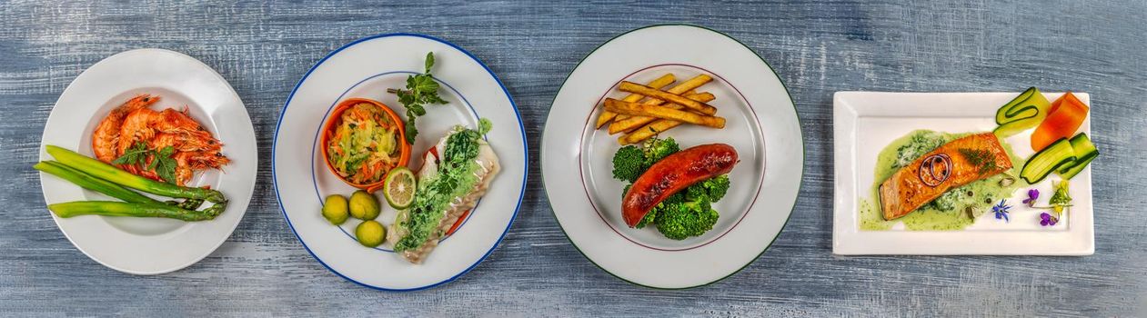 Panoramic plates of fish and cold cuts.