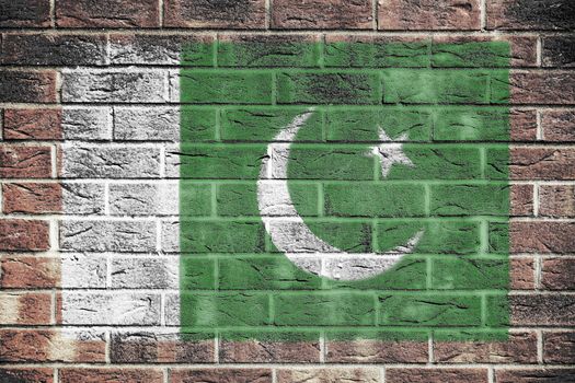 A Pakistan flag on old brick wall background