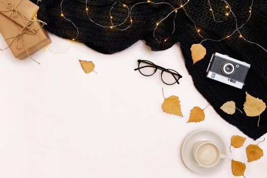 Autumn accessories for woman with yellow leaves and coffee with milk, top view. Flat lay. Copy space. Still life