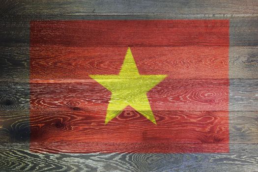 A Vietnam flag on rustic old wood surface background