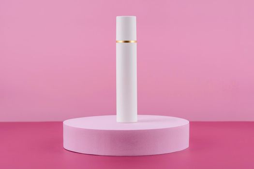 White pump cosmetic product on podium pedestal. Facial cream bottle on pink background, lotion in dispenser for woman skincare routine. Beauty moisturiser packaging. Sunscreen presentation mock up.