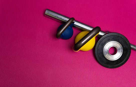 Red rod weight sport yellow blue green steel barbell, concept healthy lifestyle training mat in workout from space towel, view muscular. Nobody build flat,