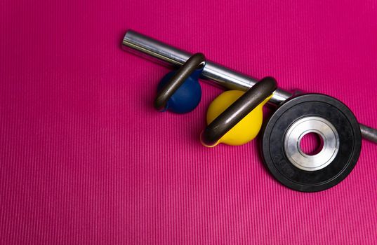 Weight red sport rod yellow blue green equipment health, for training mat from workout from room trainer, view activity. Interior build background,