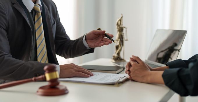 Businesswoman and lawyer adviser discuss the contract agreement document. Treaty of the law. sign a contract business concept