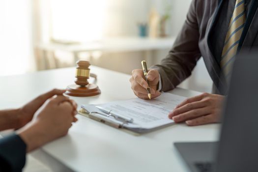 Businesswoman and female lawyer or judge consult having team meeting with client, Law and treaty of the law. Sign a contract business.