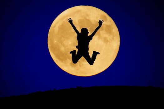A young man jumping to the moon. Shooting Location: Tokyo metropolitan area