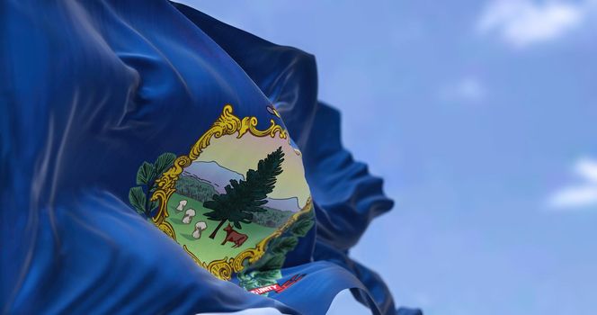 The US state flag of Vermont waving in the wind. Vermont is a state in the New England region of the United States. Democracy and independence.