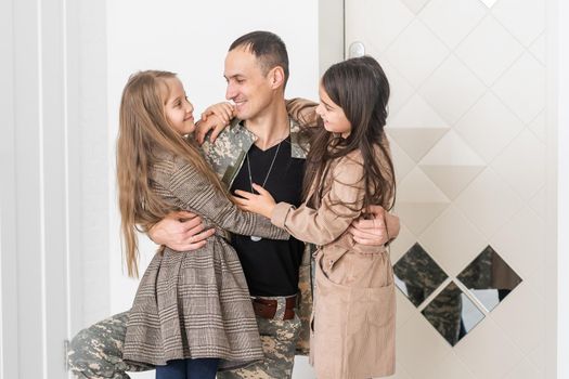 Military father with his family at home.