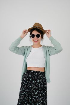 Asian girl tourist wearing sunglasses and hat, isolated on white background. summer travel concept.