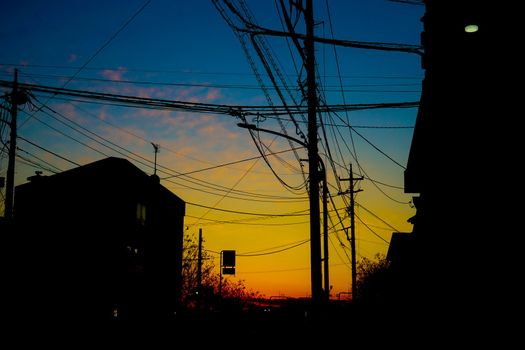 Silhouette of gradient sky and electric wire. Shooting Location: Tokyo metropolitan area