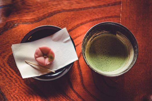 Matcha and Japanese confectionery placed in Japanese style table. Shooting Location: Tokyo metropolitan area