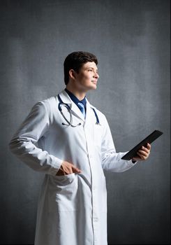 The doctor with the computer tablet. Digital technology in healthcare
