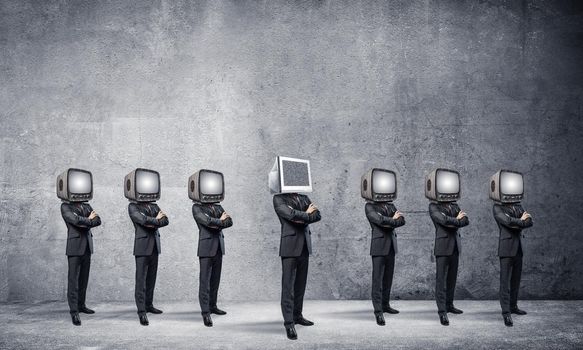 Businessmen in suits with old TV instead of their heads keeping arms crossed while standing in a row