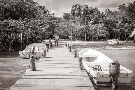 Muyil Mexico 02. February 2022 Old black and white picture of panorama view to the Muyil Lagoon in the tropical jungle nature forest boats people in Sian Ka'an National park Muyil Chunyaxche Mexico.