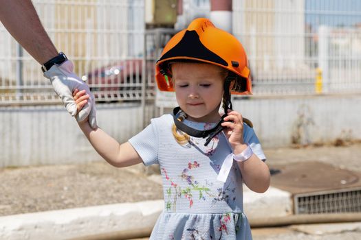 Father teaches his daughter Firefighter