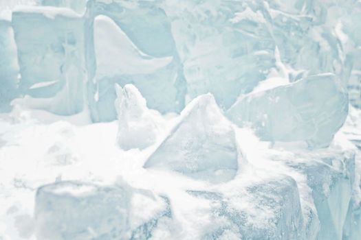 Backdrop with blue ice, snow. Nature in Russia. Frost, blue ice