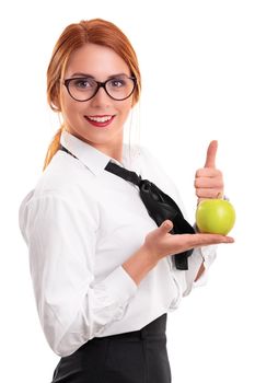 Beautiful young businesswoman holding an apple and raising thumb up, isolated on white background. Eating healthy, work life balance concept.