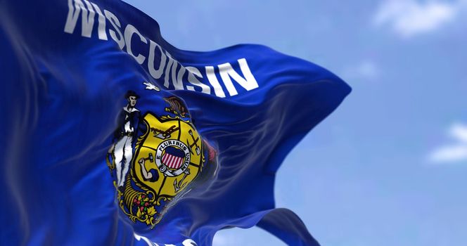 The US state flag of Wisconsin waving in the wind. Wisconsin is a state in the upper Midwestern United States. Democracy and independence.
