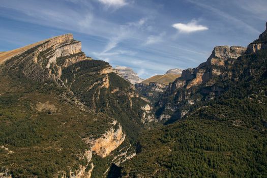 Landscape showing some high mountains under a blue sky in the Pyrenees