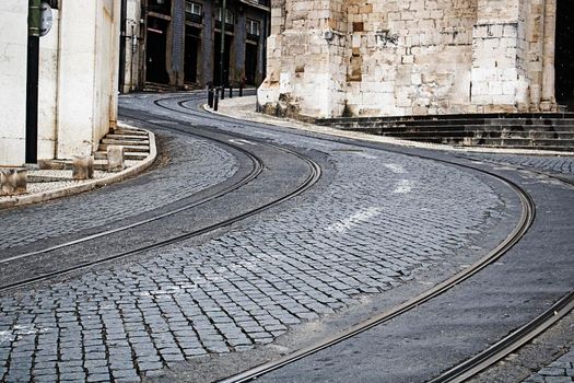 S shaped trolley car rail in a street in Lisbon Portugal