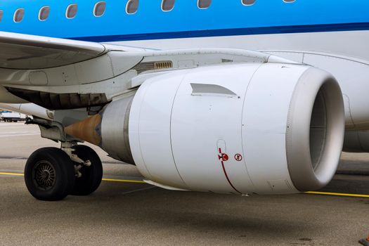 Close up of an engine of big passenger airplane on airport