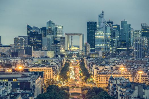 View of La Defence Paris business district from Place Charles De Gaulle at dusk.