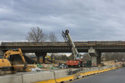 Restoration large road construction site in the renovation bridge of a modern road interchange in USA