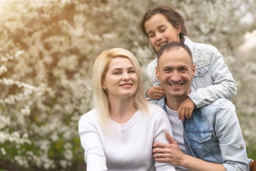 Happy family having picnic in nature. Smiling family picnicking in the park. spring nature.