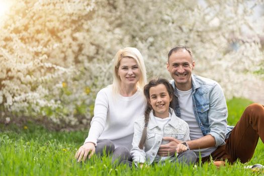 Happy family having picnic in nature. Smiling family picnicking in the park. spring nature.