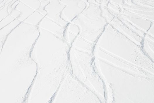 Curly ski trail on the snow in the mountains of Antarctica. Freeride off-piste skiing concept.