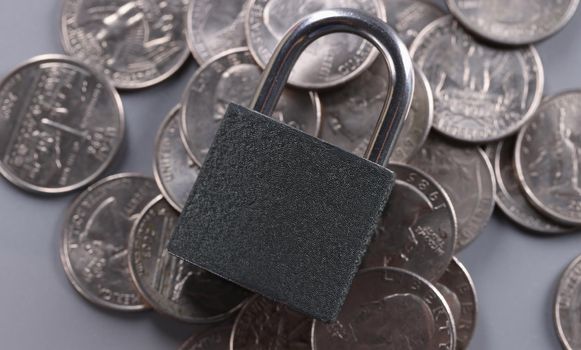 Close-up of padlock on coins, financial security and protection finance. Keep savings in secure place. Keep money savings in secure place