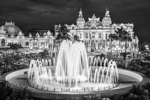 The Monte Carlo Casino, gambling and entertainment complex located in Monte Carlo, Monaco, Cote de Azul, France, Europe. Black and white image.