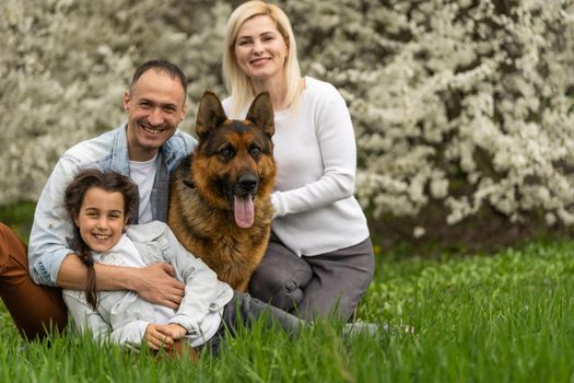 Happy family having picnic in nature. Smiling family picnicking in the park. spring nature.