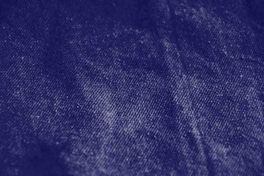 Navy classic blue fabric texture background top view. Crumpled Cloth Blank Background. Colour of the year 2020. Trendy Classic Blue color. Fabric natural surface background. Selective focus.