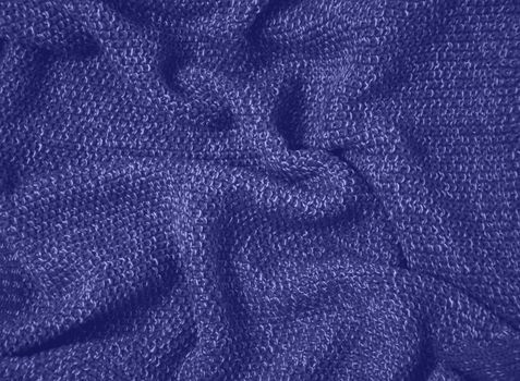 Very peri toned colour monochrome texture knitted fabric. Lavander knitted Jersey as textile background. Monochrome color background. Wool knitting texture. Trendy color 2022. . High quality photo