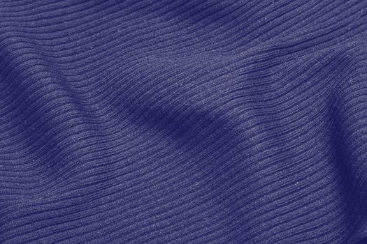 Very peri toned colour monochrome texture knitted fabric. Lavander knitted Jersey as textile background. Monochrome color background. Wool knitting texture. Trendy color 2022. . High quality photo