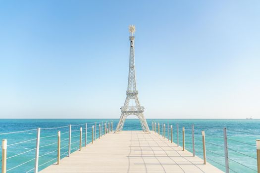 Large model of the Eiffel Tower on the beach