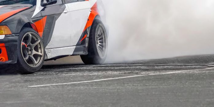 Race drift car burning tires on speed track