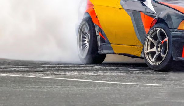 Race drift car burning tires on speed track