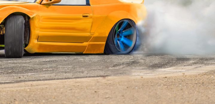 Race drift car burning tires on speed track