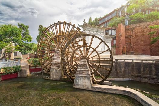 Water wheel is a symbol of Lijiang old town , the World Heritage Site in 1997  , Yunnan, China.