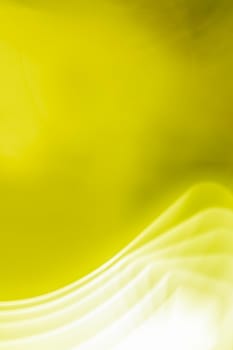 Bright yellow green olive vertical abstract background with white glowing waves. Provides space for text. Back.