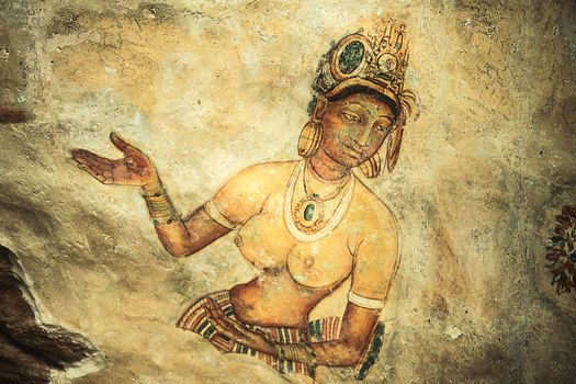 Wall painting (frescoes) in Sigiriya an ancient rock fortress , Apsara celestial nymphs - ancient painting on the walls in the Lion Rock cave, Sigiriya, Sri Lanka