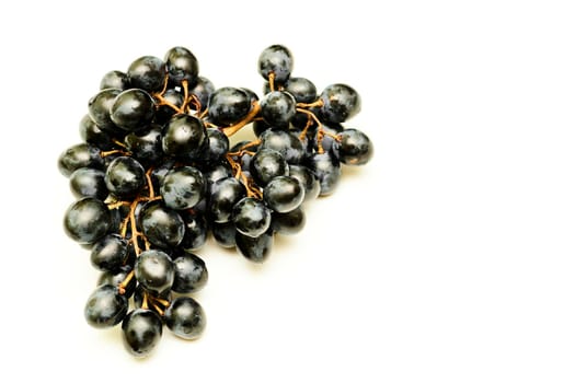 a berry, typically green classified as white, purple, red, or black, growing in clusters on a grapevine, eaten as fruit, and used in making wine.solated bunch of grapes on clean white space.