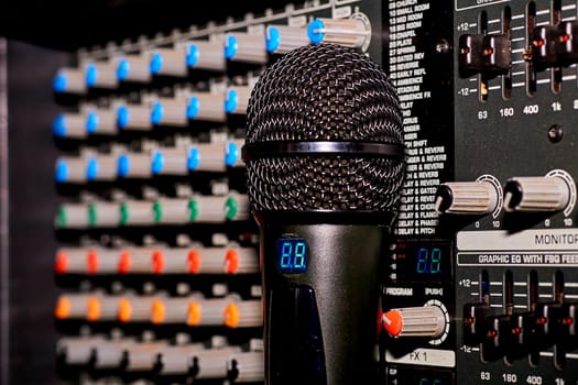 a form of entertainment, offered typically by bars and clubs, in which people take turns to sing popular songs into a microphone over prerecorded backing tracks.