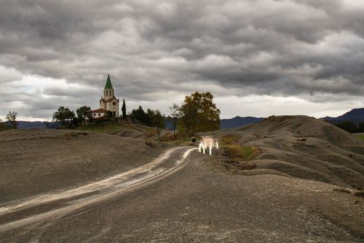 Puig Agut Sanctuary at the end of the path under cloudy sky in Manlleu, a town in Catalonia